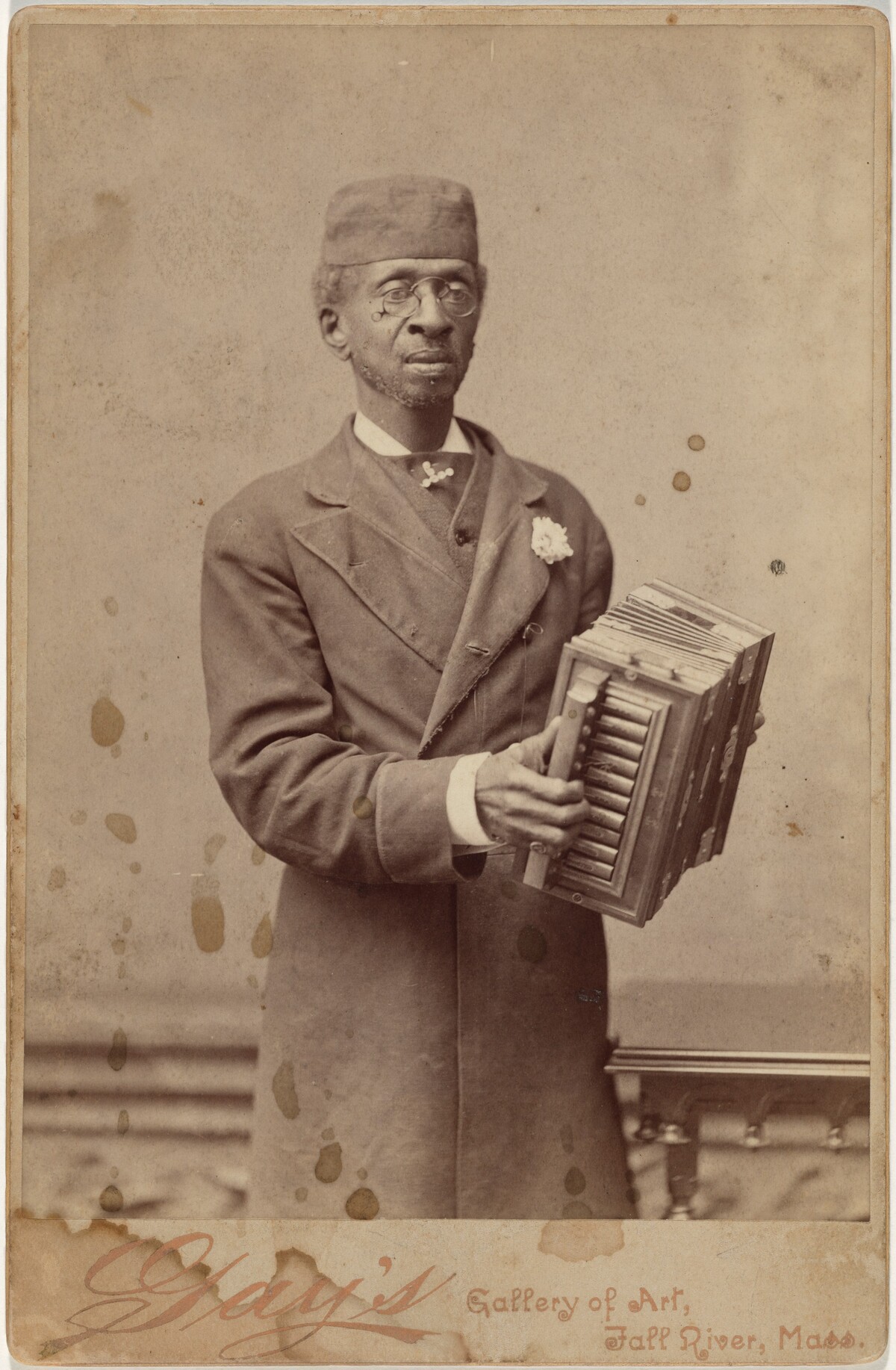 Portrait of a Man Holding an Accordion
