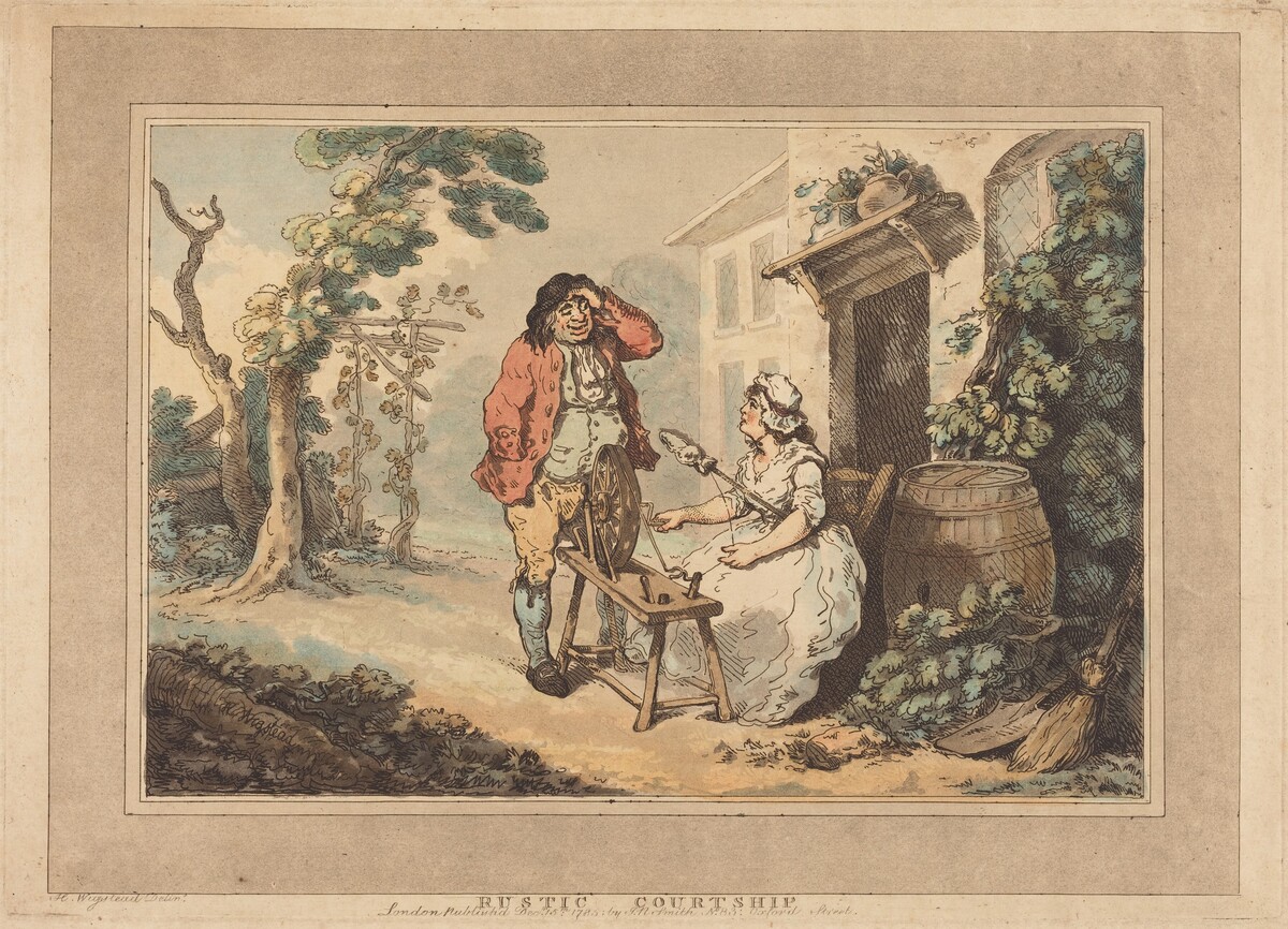 The image shows two people in a rustic outdoor setting. The man is standing with one hand on his head, facing the woman. He has a broad smile, shoulder-length dark hair, and is dressed in an earthy red coat, light blue waistcoat, yellow breeches, blue stockings, and black shoes. The woman is seated on a chair, spinning using a wheel in front of her. She has dark hair, wears a white bonnet, and a white dress with long sleeves. Surrounding them are a barrel, a broom against the wall, a tree with green foliage, a simple wooden house with a thatched roof, and an earthy ground with grassy patches.