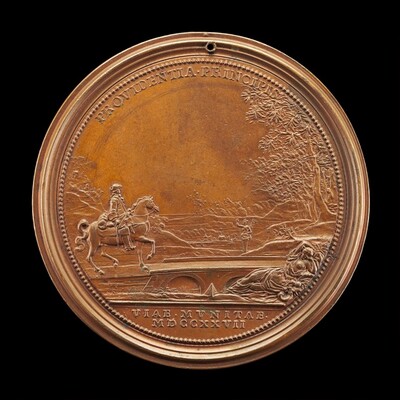 The image shows a round, flat medal with a relief sculpture on its front side. The sculpture features a person on horseback crossing a bridge in an outdoor setting with trees and distant landforms in the background. The scene is detailed with intricate lines depicting the scenery and is crafted from a bronze-colored material. An inscription in Latin surrounds the edge of the medal with "PROVIDENTIA PRINCIPIS" at the top and "VIAS MUNITAS MDCCXXVII" at the bottom. A small perforation near the top suggests it may have been used for display or worn on a chain.
