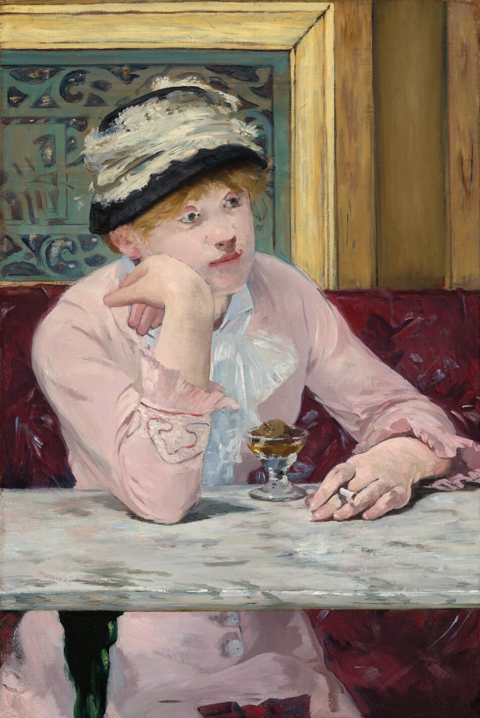 A woman with light skin sits facing us across a marble-topped table in a café in this vertical painting. Her body is angled slightly to our right, and she rests her right elbow, on our left, on the table. She leans her right cheek onto the back of her right hand as she gazes into the distance. She holds a cigarette in her other hand, which rests on the tabletop. Her pale pink dress has long sleeves with ruffles at the cuffs, and buttons down the front of the skirt can be seen under the table. A lace bow or ruffles cascade down at her neck. Straw-colored hair peeks out under a black hat encircled with a wide band of lace. A short, stemmed glass sitting on the table in front of her holds a small, round piece of fruit surrounded by caramel-colored liquid. The white marble tabletop is streaked with gray. The burgundy, patterned banquette she sits on takes up the bottom half of the composition, and wood paneling around a slate-gray metal grate fills the top half. Loose brushstrokes are visible throughout. The artist signed the work as if he had written his name on the surface of the table, near the front edge to our left, "Manet."