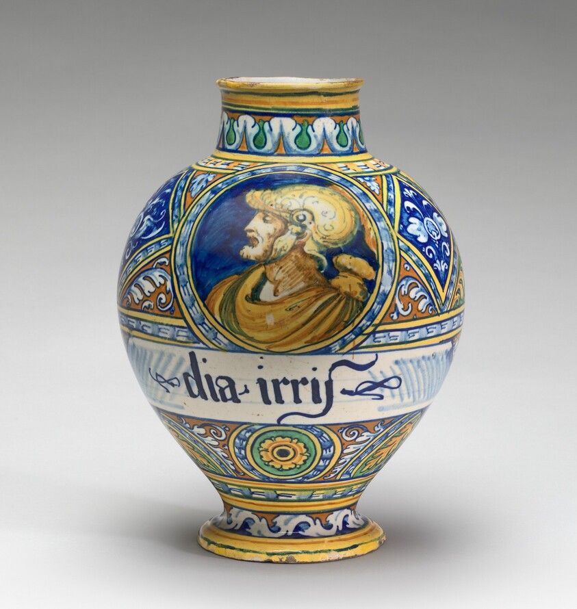 Drug jar with the head of a warrior