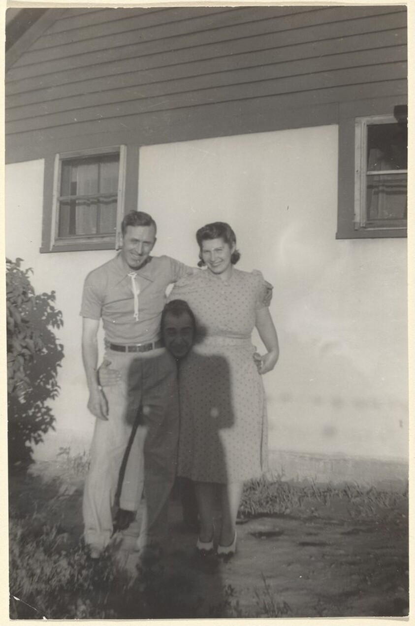 Untitled (Couple posing with woman's shadow between them)