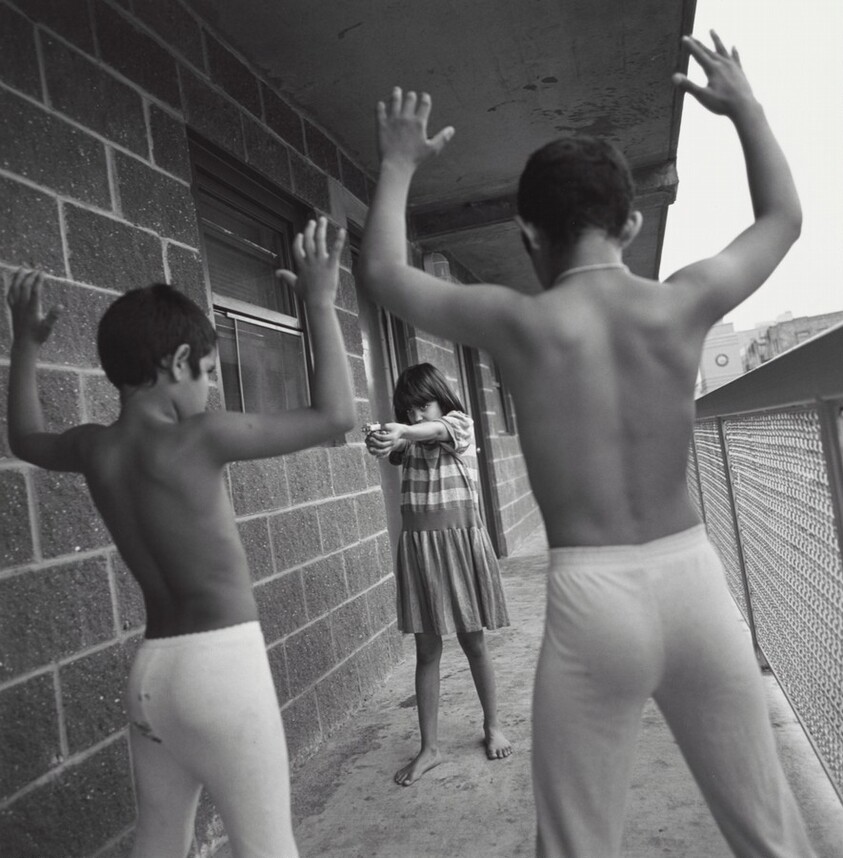 Hector, Jessica, and Pablo Sanchez playing cops and robbers at a HELP USA site, Bronx, New York