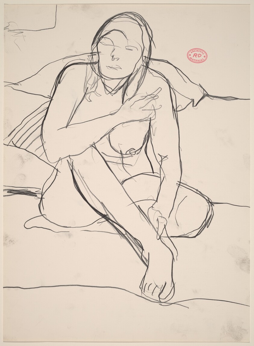 Untitled [female nude seated in front of a bed]