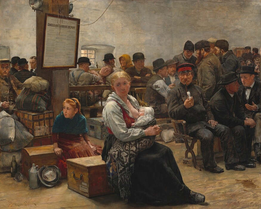 About two dozen men, women, children, and a baby sit in rows of wooden benches or on traveling trunks in this horizontal painting. Their skin is mostly pale with some ranging more toward pink and others toward tan. A woman nursing a baby sits in the center of the composition. Her blond hair is pulled back, and she wears a white blouse under a red vest and a long black skirt. Her shirt is pulled down to expose one breast, and the feeding baby wears a white bonnet and clothing, and is wrapped in a gray-patterned blanket. The woman sits on a wooden trunk in front of a young girl, who sits on a second chest just behind her and to our left. This girl has strawberry blond hair held back under a black headband, and she wears a blue shawl over a brick-red dress. Three silver pans, a silver jug, a glass bottle, and tin cup sit next to her trunk. She leans forward and looks intently off to our left. A man with a red beard wears glasses, a brown suit, and a flat-topped straw hat sits farther back in the room on the far side of bulging sacks and more trunks. He looks into the distance off to our right. Three men wearing black suits and two wearing black bowler hats sit facing each other just over this man’s shoulder. In the right two-thirds of the painting, more men wear fedoras, bowler hats, or brimless caps. Their clothing ranges from vests over button-down shirts to suits and ties. Some wear overcoats, and some are bearded. One man wears a military-style hat, a double-breasted black coat, and smokes a pipe with a white bowl. He looks toward the nursing woman, as does a standing man farther in the room. The men sit alone or chat in groups of two or three, and one sleeps, propped up against a fabric bag. A few more women are among the group, including one older woman who wears a yellow scarf tied over her head to the left. A sign hanging on a column behind the nursing woman begins with the text, “Emigrant Landing Depot” over columns of fine print. The walls of the room are mottled fog and cream white, and one visible window is small within the thick wall. The floor is wooden planks and there is a brown stain near the lower right corner.