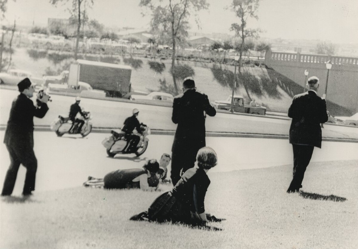 Title from caption on object: “Spectators Hug the Ground...”