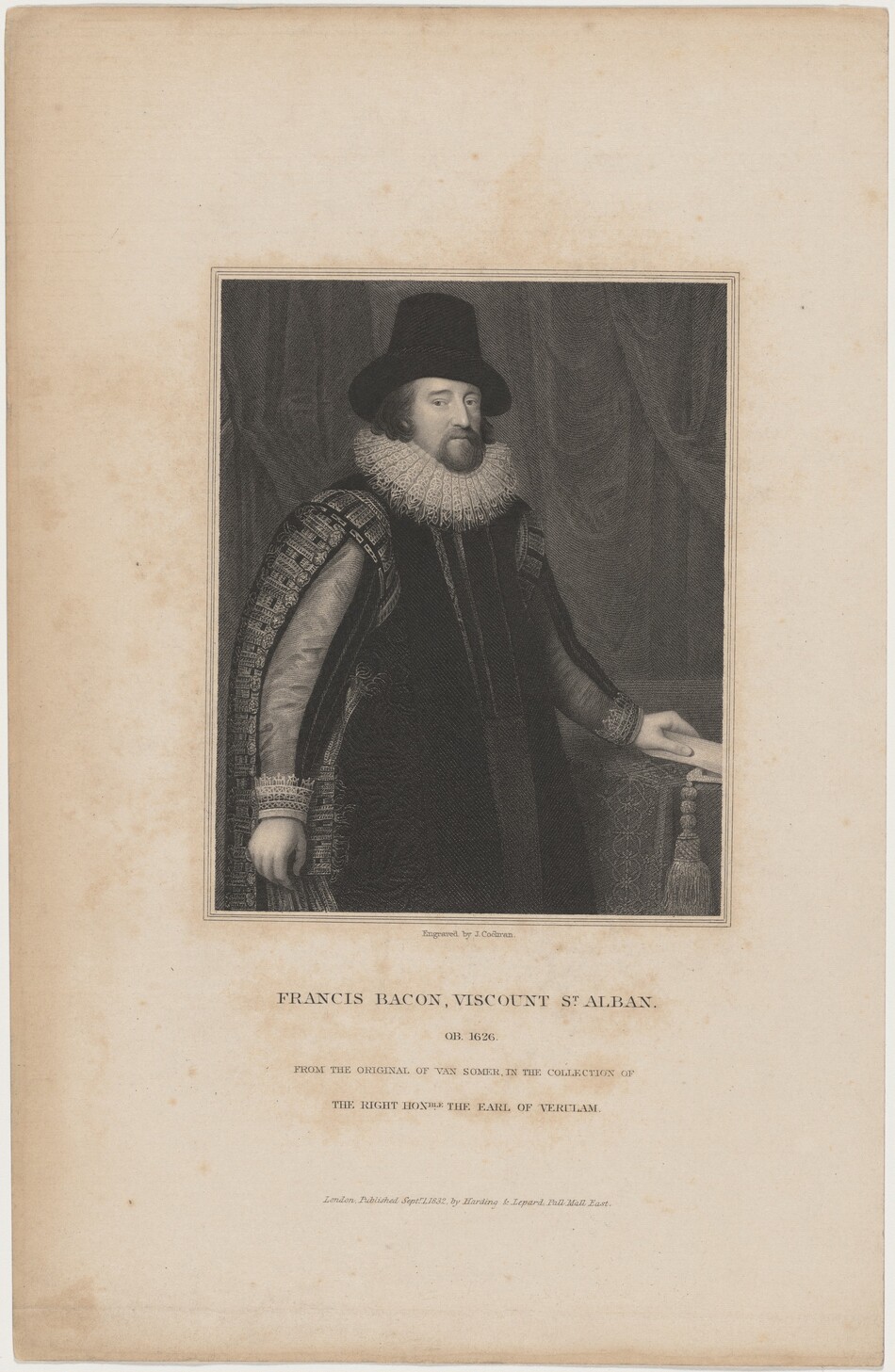 The portrait depicts a man in a historical formal outfit, featuring a mustache and a neatly trimmed beard. He is standing with one hand resting on a decorative surface. The man is positioned slightly turned to his right, facing towards the viewer. He wears a dark, broad-brimmed hat and a garment with elaborate patterns, along with a large, ruffled collar. The background is plain with draped fabric.