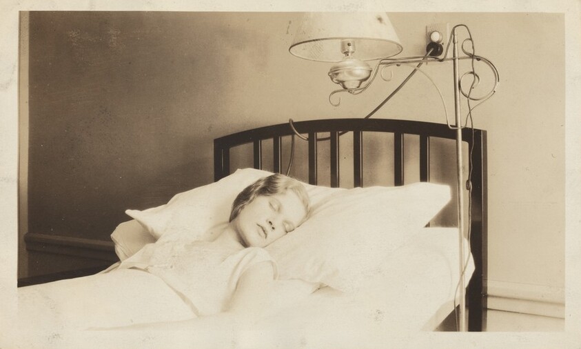 "This is the one when I was asleep. I had been in the hospital almost a month so I look kind of worn down. This picture does not do my room justice. It was all in pink and blue. I had a French telephone beside my bed on the radio that doesn't show up..."