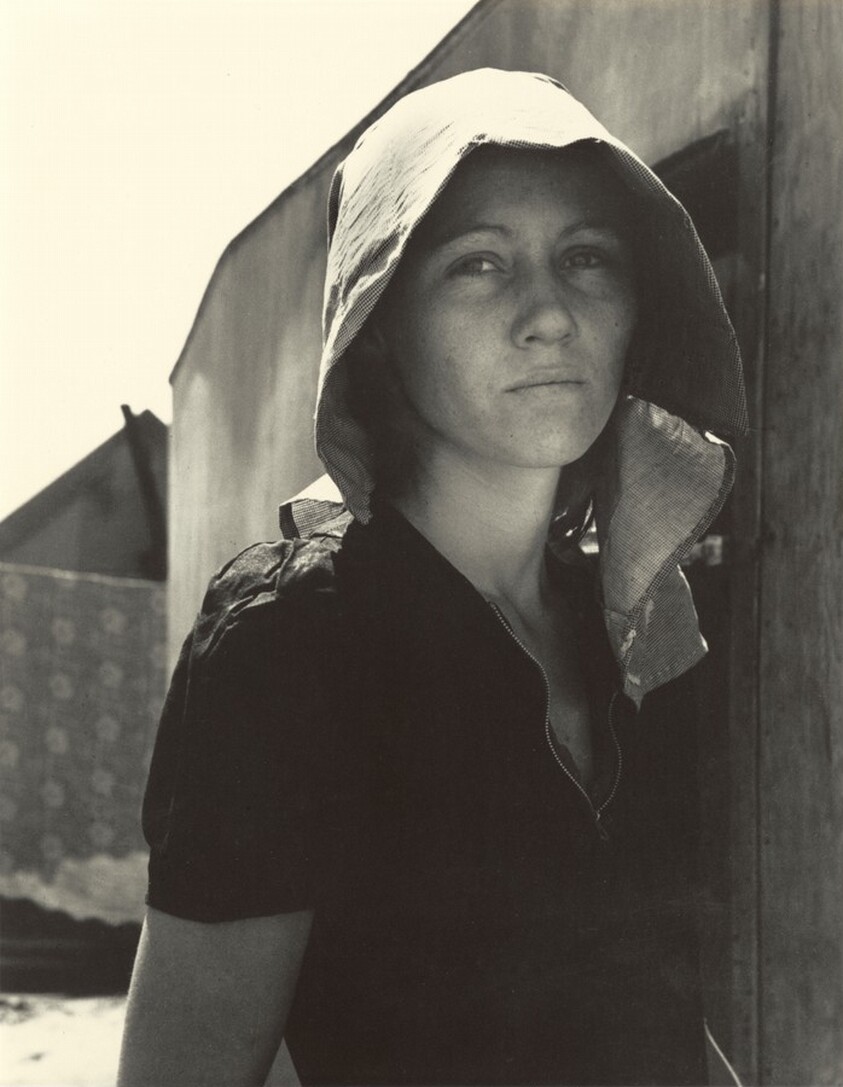Edison, Kern County, California. Young migratory mother, originally from Texas. On the day before the
photograph was made, she and her husband traveled 35 miles each way to pick peas. They worked 5 hours each and together earned $2.25. They have two young children . . . Live in auto camp.