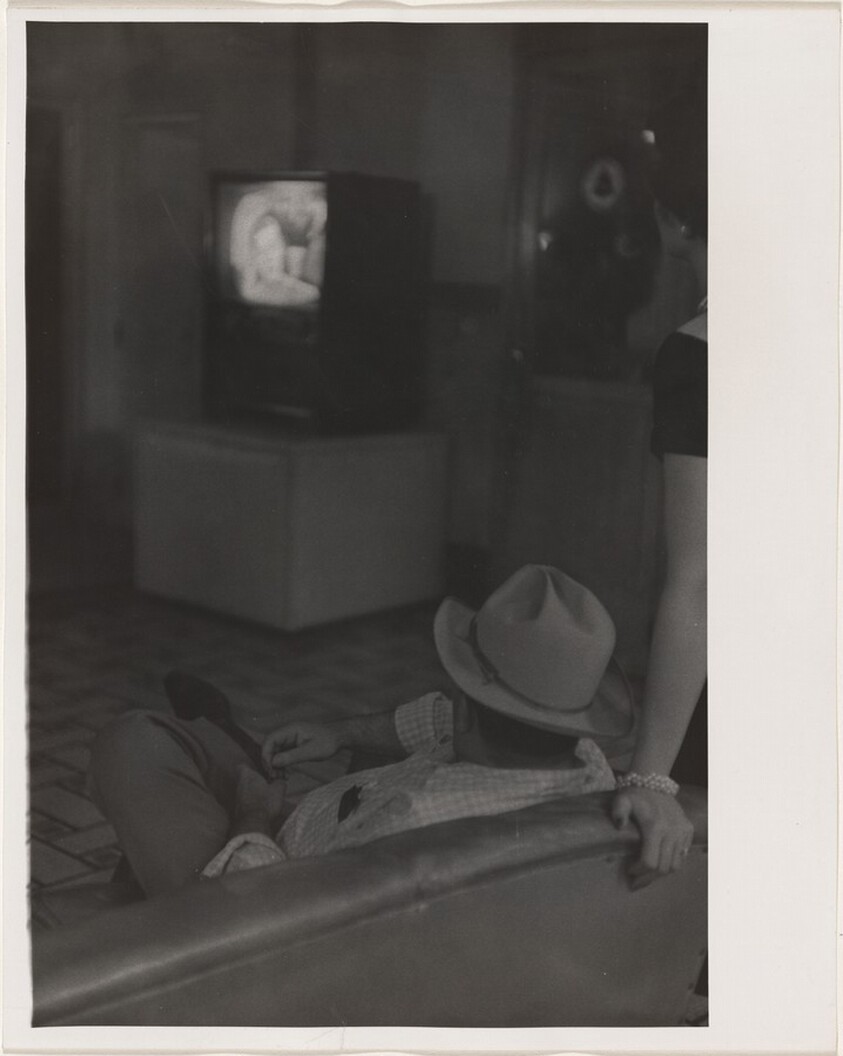 Couple watching TV in lobby--Casper, Wyoming