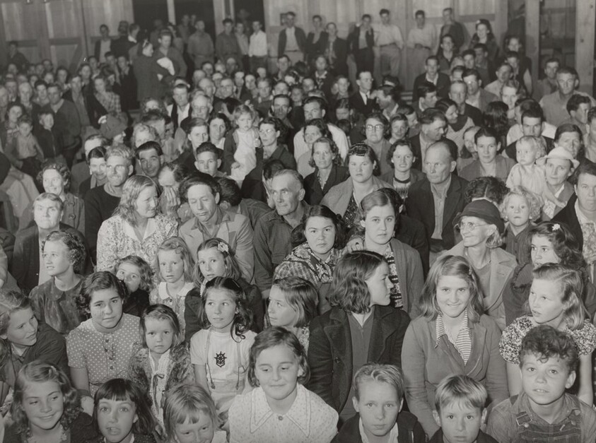 Audience watching play in recreation hall, Tulare Migrant Camp, Visalia, California