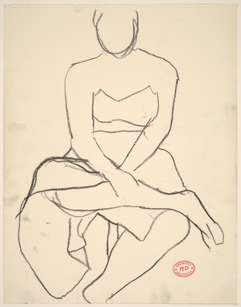 Untitled [model in skirt seated with her legs crossed]