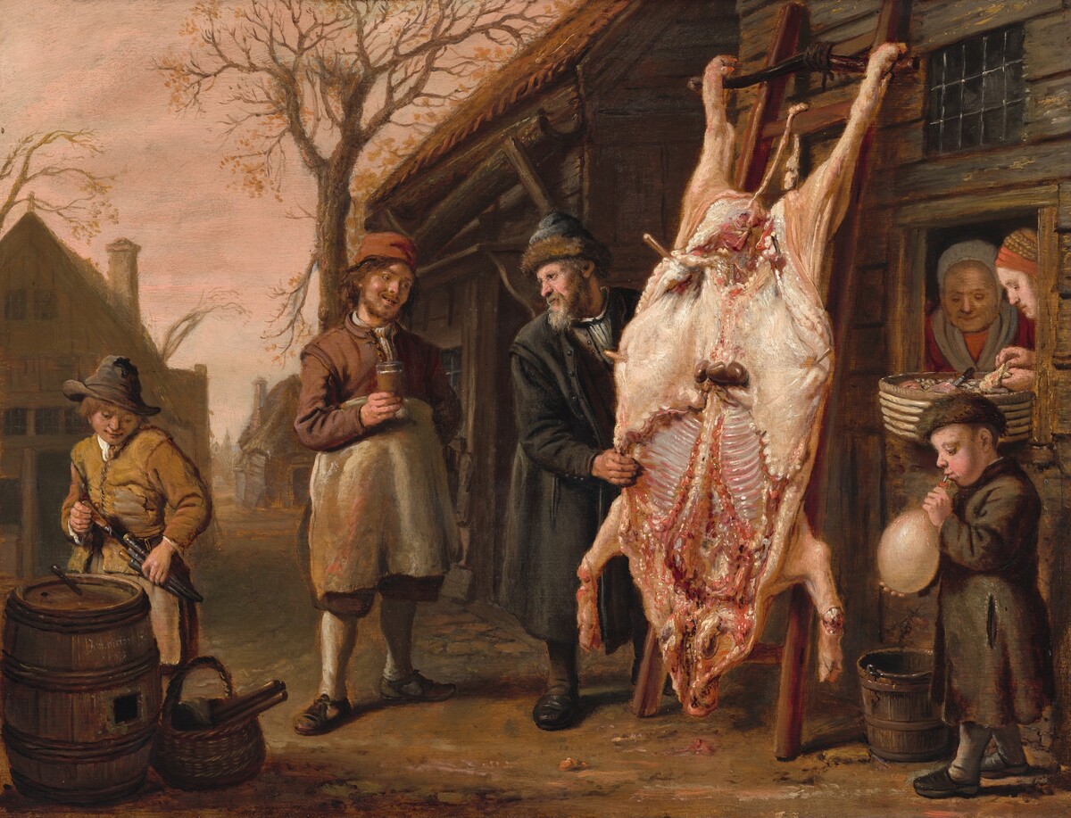 In the center of this painting, a large animal carcass is hanging upside down from a wooden frame, with several people attending to it. The carcass is light pink and has been cut open to reveal white ribs, red muscles, and purple organs. On the far left, a young boy stands next to a barrel and a basket, holding several small knives. To the right, a man in a red cap and white apron observes the carcass while holding a drink. An older man in a furred cap and dark clothing looks towards him and holds one edge of the carcass. On the other side of the animal, a young boy blows up a round object. Two women peer out from the doorway of a wooden building in the background, one holding a basket full of what looks like meat. Behind this group of people are several brown structures and a bare tree against a light pink sky.