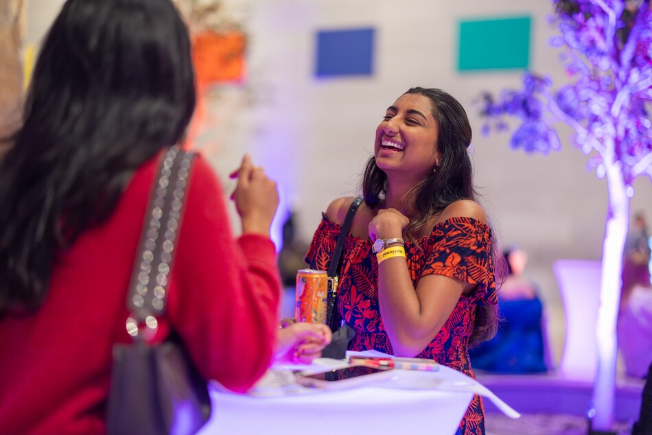 National Gallery Nights attendees laughing and enjoying themselves in the National Gallery's East Building.