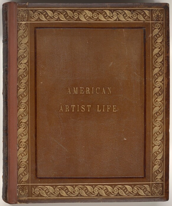 The image shows a book cover titled "AMERICAN ARTIST LIFE." The cover is made of brown leather with embossed gold lettering that reads "AMERICAN ARTIST LIFE." It features an ornate gold decorative border design along its edges with a pattern of swirls and leaves. The spine appears slightly darker than the front cover. The design conveys elegance and historical significance, typical of older collectible books.