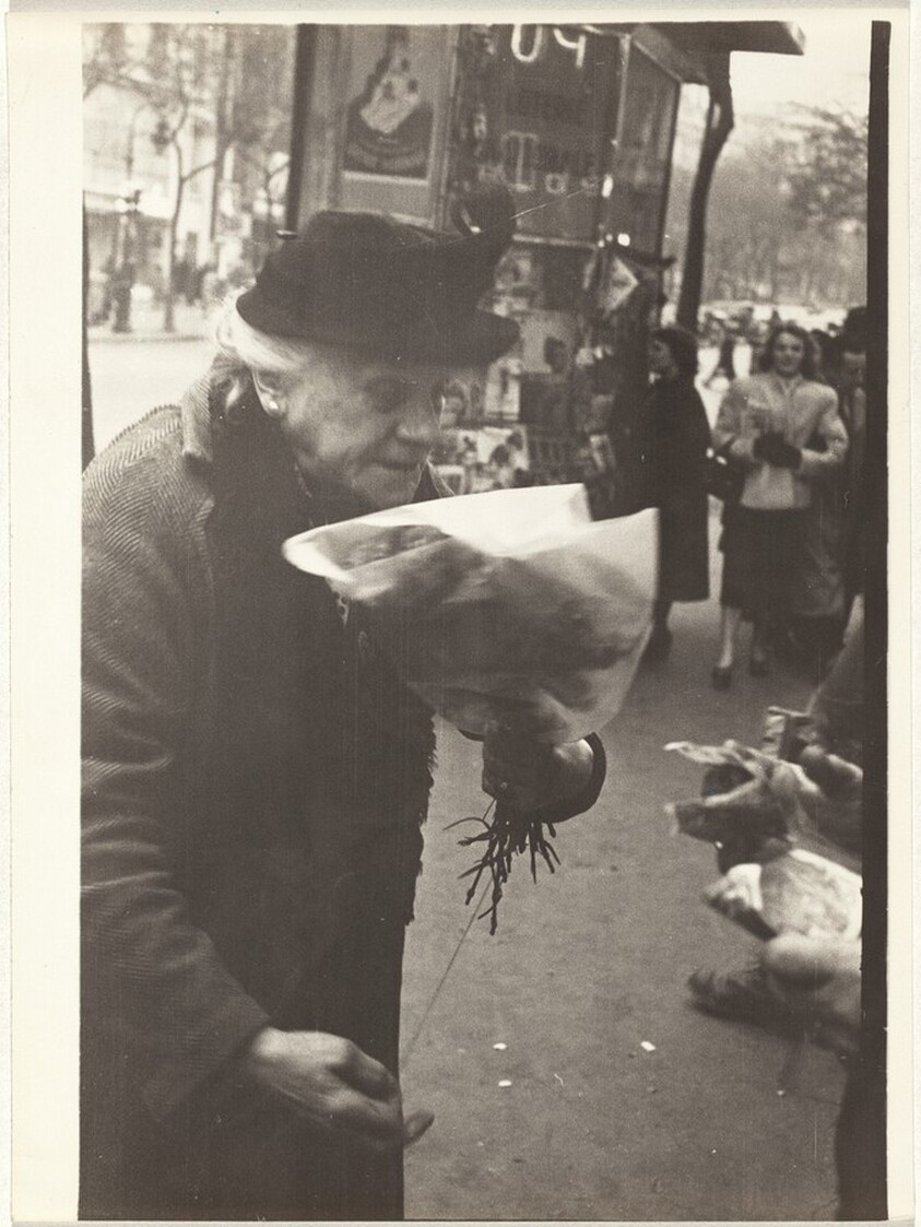 Woman buying flowers, Paris
