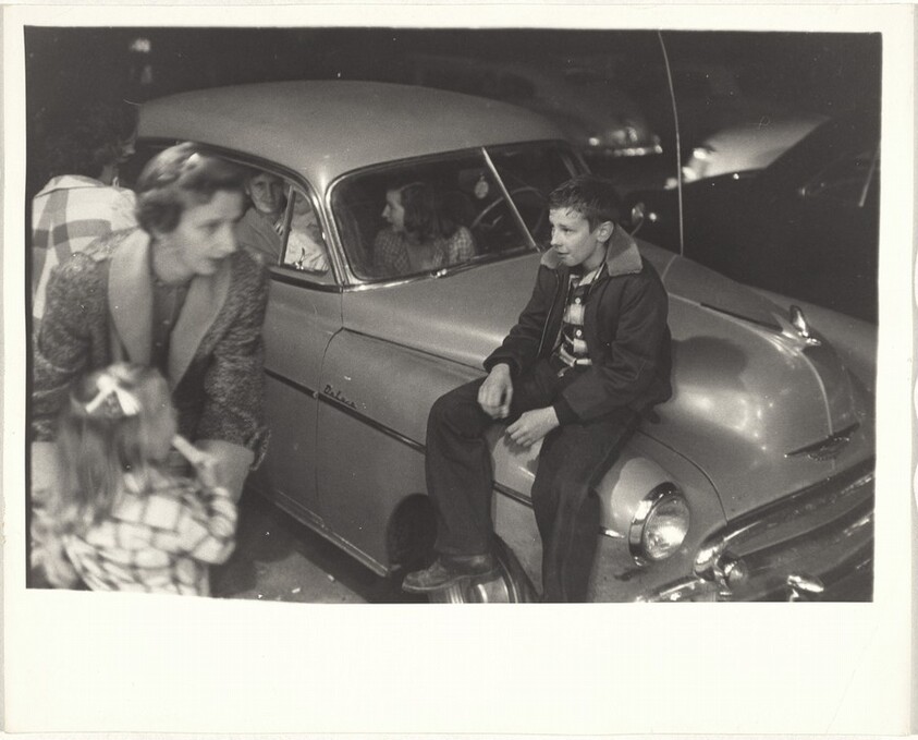 Boy sitting on automobile--North Carolina