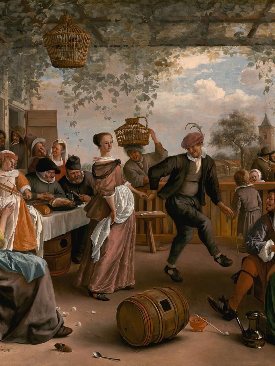 More than a dozen light-skinned men, women, and children eat, drink, talk, and make music around a dancing couple under an arbor in this horizontal painting. Most of the people are dressed in muted tones of green, gray, and black. The patio-like space is enclosed by a railing along the back and a half wall to our right. Sage-green vines and leaves covering the roof-like trellis hang down. Ten men and women sit or stand closely around a long table along the left, next to the exterior wall of a red brick building. A woman sitting in a wooden chair at the end of the table closest to us wears a flax-yellow gown with a wide white collar and a starched white cap. She smiles up at the child she braces in her lap. The child stands and holds a toy in both hands and looks over one shoulder to our right. The child wears a carrot-orange gown with a white pinafore. Two men lean out of open windows at the far end of the brick building, and the people along the table drink, smile, or look on as a man in the center leads a woman by the hand to an open spot under the arbor. He wears a charcoal-gray suit, and a muted pink cap is pulled low over his eyes. He has a long, hooked nose, and light glints off teeth in his smiling mouth. The woman is pulled behind the man, so she stands flat-footed to our left of him. She faces our right but turns to looks at us from the corners of her dark eyes. Her light brown hair is gathered at the back of her head under a pearl-lined covering. She wears a dusty rose-pink gown with a sheer black shawl around her shoulders and white apron at her waist. Beyond the back rail, a man smiles widely as he balances a covered basket containing a gray chicken with one hand on his head. Nearby, a boy on our side of the rail talks with a little girl across the railing, who smiles back. Two men and a woman wearing a black head covering talk a short distance away. Close to us, a man, woman, and child in the lower right corner sit near two young men perched on the half wall, one playing a violin and the other a flute. A gleaming pewter ewer, a wooden barrel with a square opening, a white pipe, a terracotta bowl, broken eggs, a spoon, and an overturned pail of flowers lie scattered across the foreground of the patio. The artist signed and dated the lower left, “JSteen. 1663,” with the J and S overlapping.