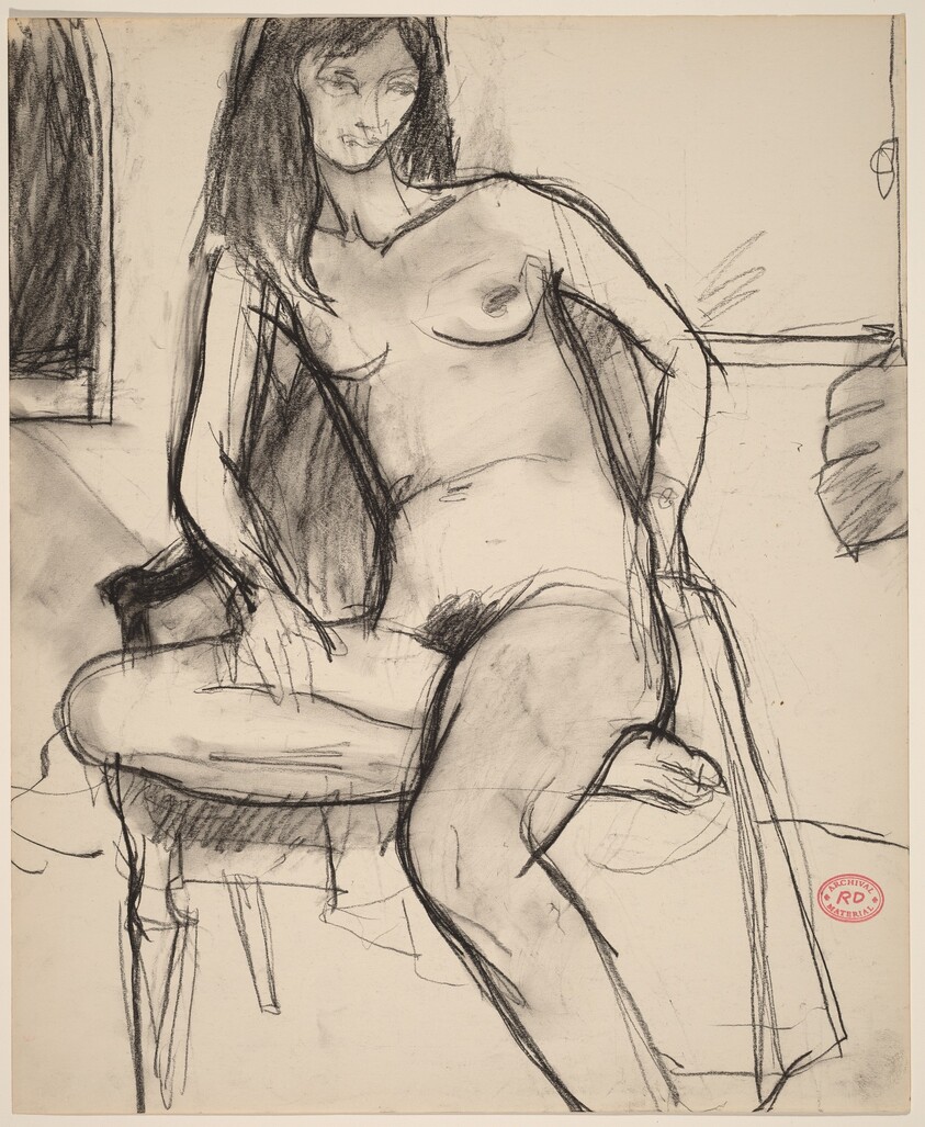 Untitled [nude in an armchair sitting on one leg]