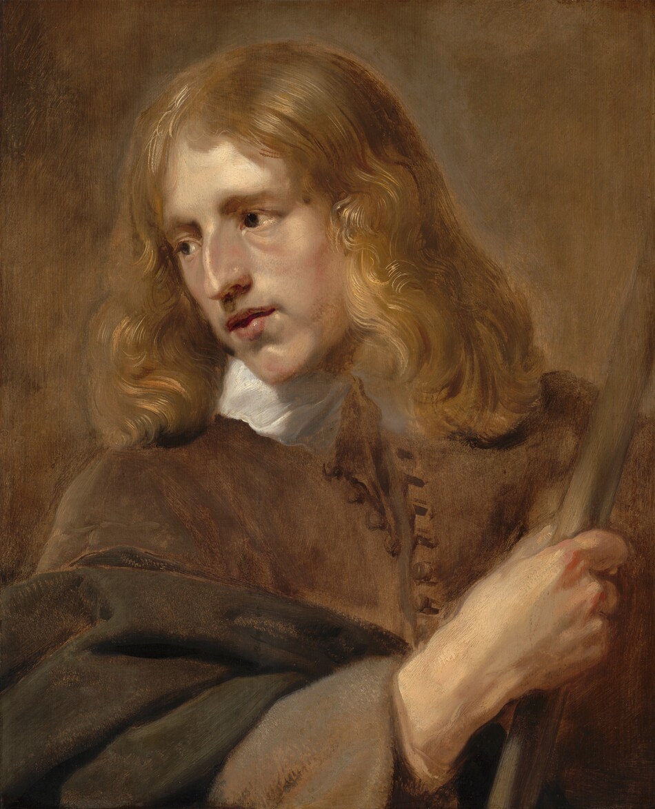 Shown from the chest up, a light-skinned, cleanshaven man looks down and to our left in this vertical portrait painting. His shoulders angle slightly to the right, but he turns to look in the other direction with dark eyes under gathered brows. He has a prominent nose, a pointed chin, and his full lips are parted. His dark blond hair is parted down the middle and falls to both shoulders. His right arm, to our left, crosses his chest, and he holds a staff with that hand along the right side of the painting. He wears a tawny-brown coat with buttons down the front over a high white collar. The background is painted with shades of fawn and peanut brown. The artist signed and dated the painting along the center of the left edge in faint brown paint: “P. Soutman F.A. 1640.”