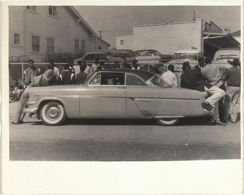 Youths leaning on automobile--San Francisco