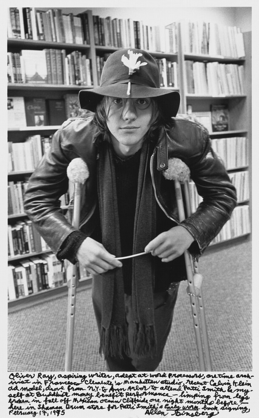 Oliver Ray, aspiring writer, adept at word processors, one time archivist in Francesco Clemente's Manhattan studio, recent Calvin Klein ad model, drove from N.Y. to Ann Arbor to attend Patti Smith & myself at Buddhist money benefit performance- limping from legs broken in fall off Mexican Ocean Cliffside one night months before. -- here in Shaman Drum store for Patti Smith's _Early Work_ book signing, February 17, 1995