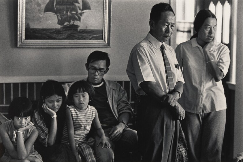 Refugee family listens to sponsors’ welcome speech