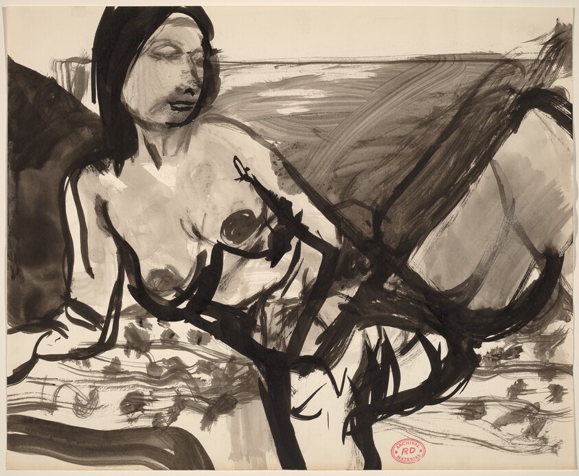 Untitled [female nude resting on a patterned cushion]