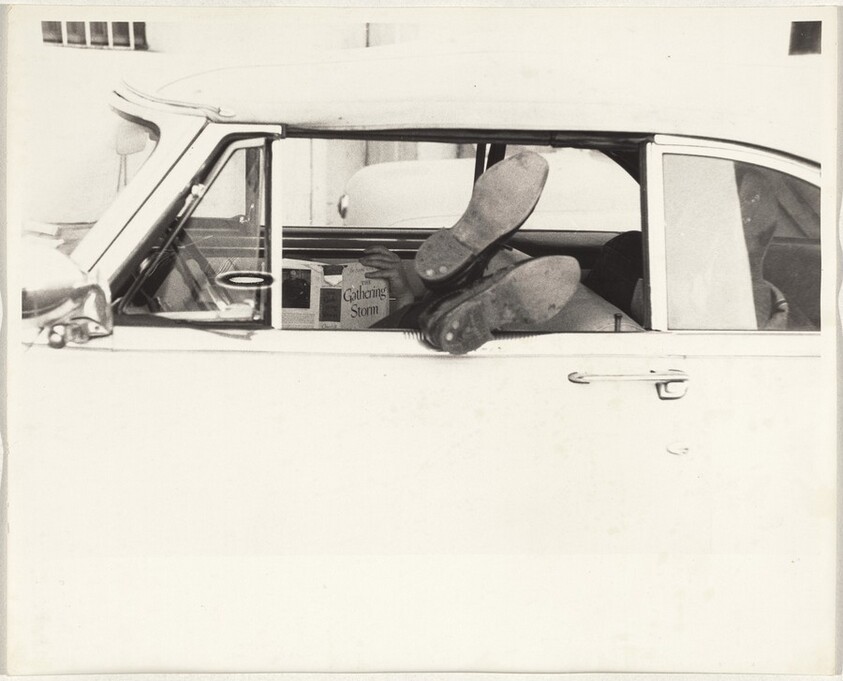 Man reading in automobile--Los Angeles