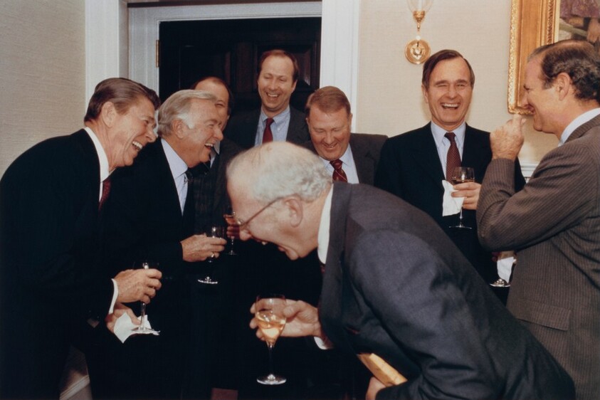 President Ronald Reagan, CBS News Anchor Walter Cronkite, White House Press Secretary James Brady (Partly Obscured), White House Staff Secretary David Gergen, Counselor to the President Ed Meese, Vice President George H. W. Bush, White House Chief of Staff James Baker, and, in the Foreground, CBS Vice President Bud Benjamin, Sharing a Joke During “A Small Pour” to Celebrate Walter Cronkite for Having Concluded His Final Interview with a Sitting President as Anchor of the CBS Evening News, Done Just Moments Before at the White House