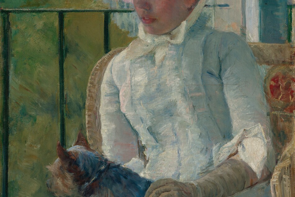 Shown from the knees up, a young woman wearing a white gown and bonnet sits in front of a balcony railing on a sunny day, holding a small dog on her lap in this vertical portrait painting. The scene is painted with visible brushstrokes, which are especially broad in the background and clothing. The woman sits with her body angled to our left, and she looks down in that direction with blue eyes. She has a short, snub nose, rosy cheeks, and her full, pink lips are parted. The woman’s bonnet is tied under her chin with a pale yellow bow. Her dress has a tightly-fitting bodice, elbow-length sleeves, and a long skirt. The bonnet and dress are painted with strokes of faint sky blue, petal pink, lavender purple, and mint green, with cream-white highlights and some darker cobalt-blue and apricot-peach strokes for shading. The dog on her lap lies with its head to our left, lifted as it looks out onto the landscape. The tan glove the woman wears on the arm we can see reaches her elbow, and she rests that hand on the dog’s back. Her right arm, to our left, is hidden below the elbow by the dog. The animal has charcoal-gray fur along its back and tan fur on the legs and shaggy face. The woman sits in a wicker armchair with a crimson-red medallion next to her left shoulder, to our right. The black balcony railing spans the width of the painting at the level of her nose, and has vertical bars. In the landscape beyond, trees to the right are painted loosely with sage green and mustard yellow. Buildings in the distance fill the top quarter of the composition, and are loosely painted with strokes of slate and aquamarine blue. The sky above is streaked with pale blush pink and ice blue. The artist signed the painting in the lower right corner, “Mary Cassatt.”