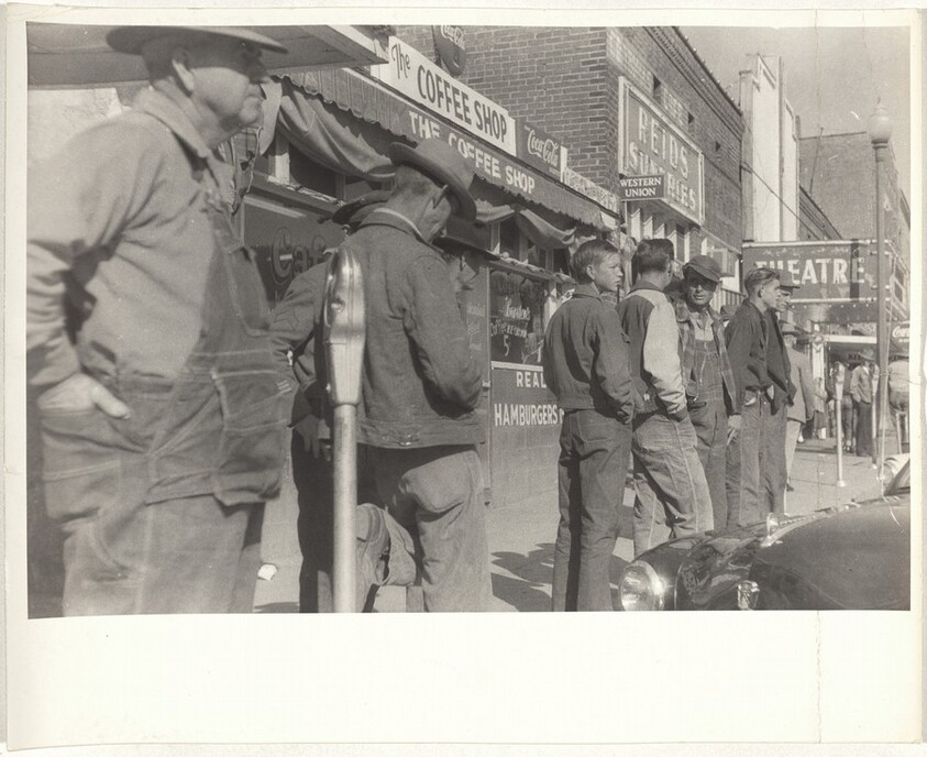 Men standing on street--Scottsboro, Alabama