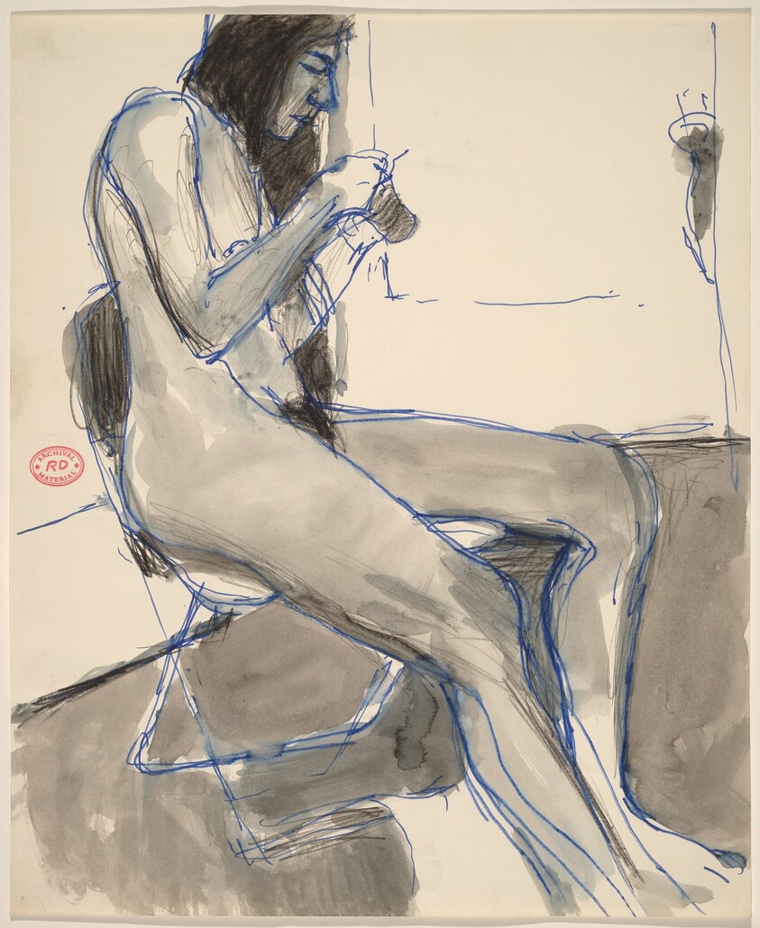 Untitled [seated female nude holding and examining an object]