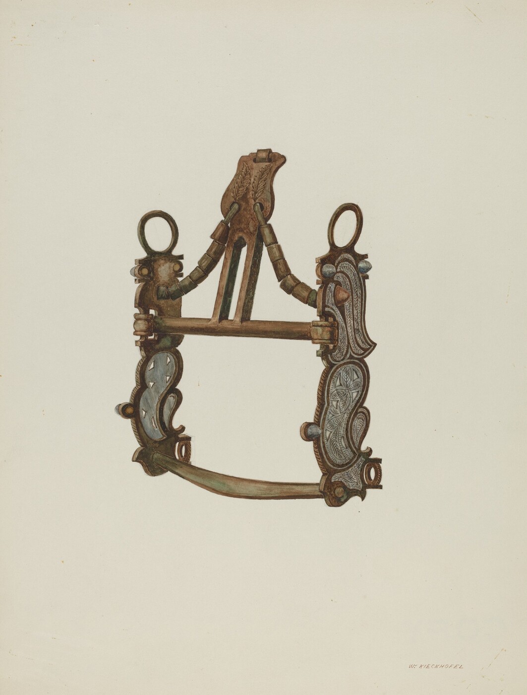 The image shows a metallic object with an intricate symmetrical design. The object appears to be a piece of harness hardware or a decorative fitting. It has a bronze or copper color with some areas showing a greenish tint from oxidation. The object is placed on a light-beige background and has a narrow upper section, widening towards the bottom, connected by ornate brackets and loops. Detailed carvings and patterns are evenly distributed on both sides of the object.