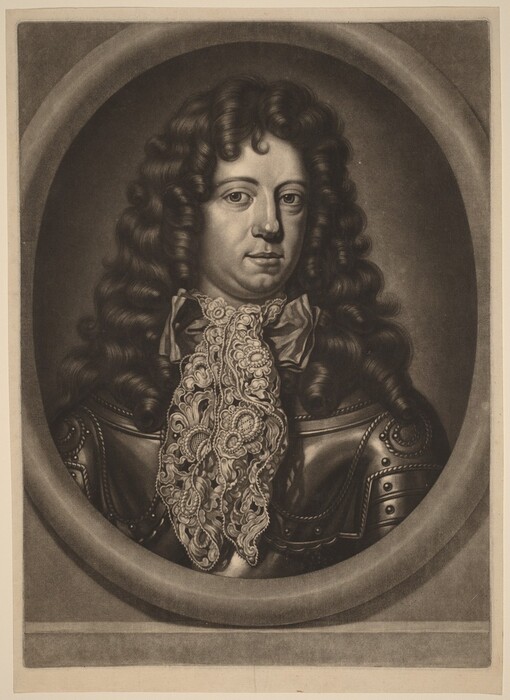 The image shows a portrait of a male figure from the chest upward. He is facing forward, looking directly at the viewer. The man has distinct facial features with slightly arched eyebrows and a prominent nose. He has long, dark, curly hair that falls past his shoulders. He is wearing an ornate lace cravat around his neck, standing out against his dark armor. The armor is detailed with studs and decorative patterns. The background features an oval frame around the figure, set against a plain backdrop, giving the portrait a classic and formal appearance.