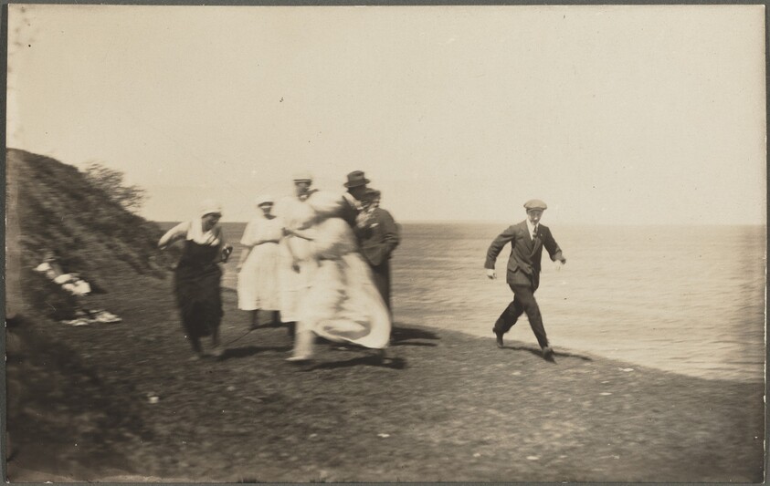 Untitled (Blurred group in motion on beach)