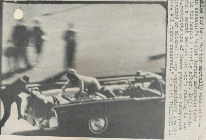 Jackie Crawling Out of Limousine as Clint Hill Jumps on Bumper