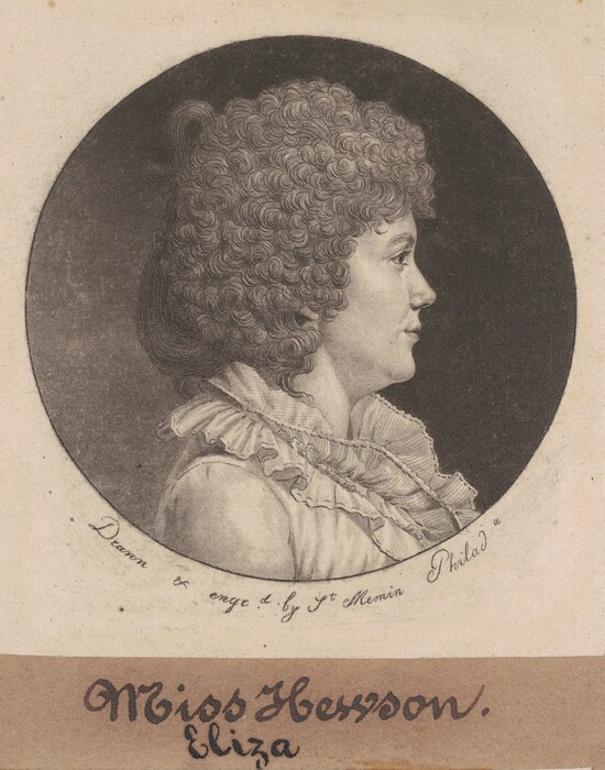 The image is a portrait of a woman in profile. She is looking to the right of the frame, showing her facial features, hairstyle, and a slight smile. Her hair is curly and voluminous, framing her head. She is wearing a garment with a wide, ruffled collar. The background is a circular dark space, giving focus to the woman. The name "Miss Hesson, Eliza" is inscribed below the portrait.
