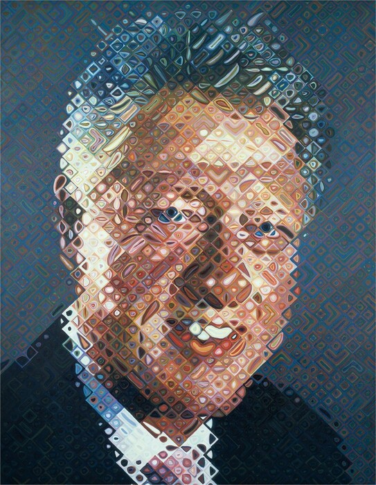 Dots and ovals bubbling across a fine grid form the head and shoulders of a smiling, silver-haired man with peach-colored skin, wearing a navy-blue jacket, a white collared shirt, and a pink tie in this vertical portrait painting. The grid runs diagonally to create mostly diamond-shaped squares, with a few rectangles, each of which is filled with concentric circles or ovals around a dot. The man’s face fills most of the composition, and he looks at us with blue eyes. He has a rounded nose and bright white teeth show between full, rosy lips. His hair is short on the sides and a little longer and brushed back on top. The background is mostly slate blue but also has squares and circles in brick red, mustard yellow, and teal green. The overall effect is of a slightly unfocused, pixelated image because of the grid and nested circles used to create each unit.