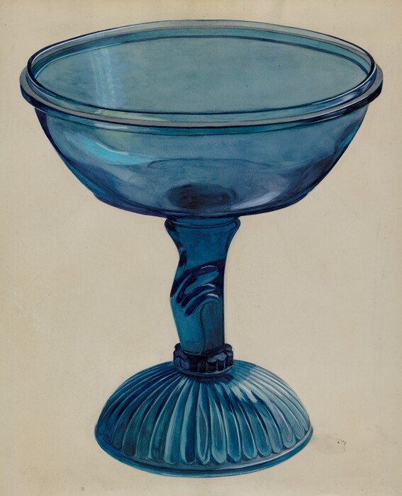 The image shows a large, blue pedestal glass bowl. The color palette consists of various shades of blue. The bowl has a detailed design with the stem shaped like a sculpted hand and the base featuring a ribbed pattern.