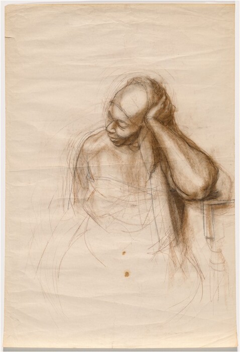 The image is a drawing of a person depicted from the waist up. The person is seated and is leaning slightly to their left, with their elbow resting on a surface. Their head is tilted towards their left hand, which is placed on the side of their head. The person's face is angled slightly downwards and turned to the side, showing gentle facial features, with a prominent chin and cheekbones. They have very short hair. The person's upper body is sketched in contours without detailed clothing, and the lines suggest relaxed shoulder posture. There is no visible jewelry or objects held. The background is plain and appears to be an unfinished section of the drawing paper, with light sketch lines visible around the figure.