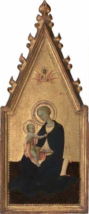 A woman holding a nude child sits against a gold background in this vertical painting, which has a long, pointed top. They both have pale skin tinged with green, blond hair, delicate features, and pink cheeks. The woman sits on a cushion with her body angled to our left and holds the baby on her right knee. She tips her head and looks down at the child with hooded eyes. She wears a cream-white dress under a midnight-blue cloak lined with forest green. She braces the baby’s torso with her right hand, to our left, and holds the pale pink cloth on which he sits with the other. The child’s body faces her, and he touches the clasp of her cloak with one hand. The other hand rests on her shoulder. Both have decorative, patterned halos punched into the gold background. The white cushion is patterned with white-petaled flowers with tiny red centers. The brown floor is speckled with white dots and perhaps minuscule flowers, but the area is dark and difficult to make out. A bearded man shown from the waist up floats overhead in a much smaller scale. He has a gold halo, blond hair, and wears a yellow robe. Six pink wings are lined up down his arms. Gold rays fan down from his body to reach a white bird between him and the woman. The panel has molding around its edges and flame-like carvings up the pointed top.