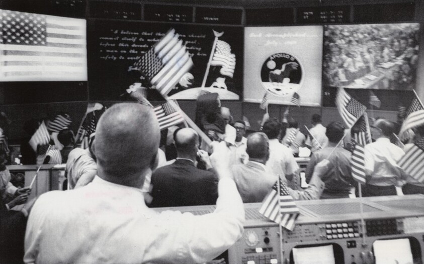 Title from caption on object: "This Was the Celebration Scene in Mission Control...”