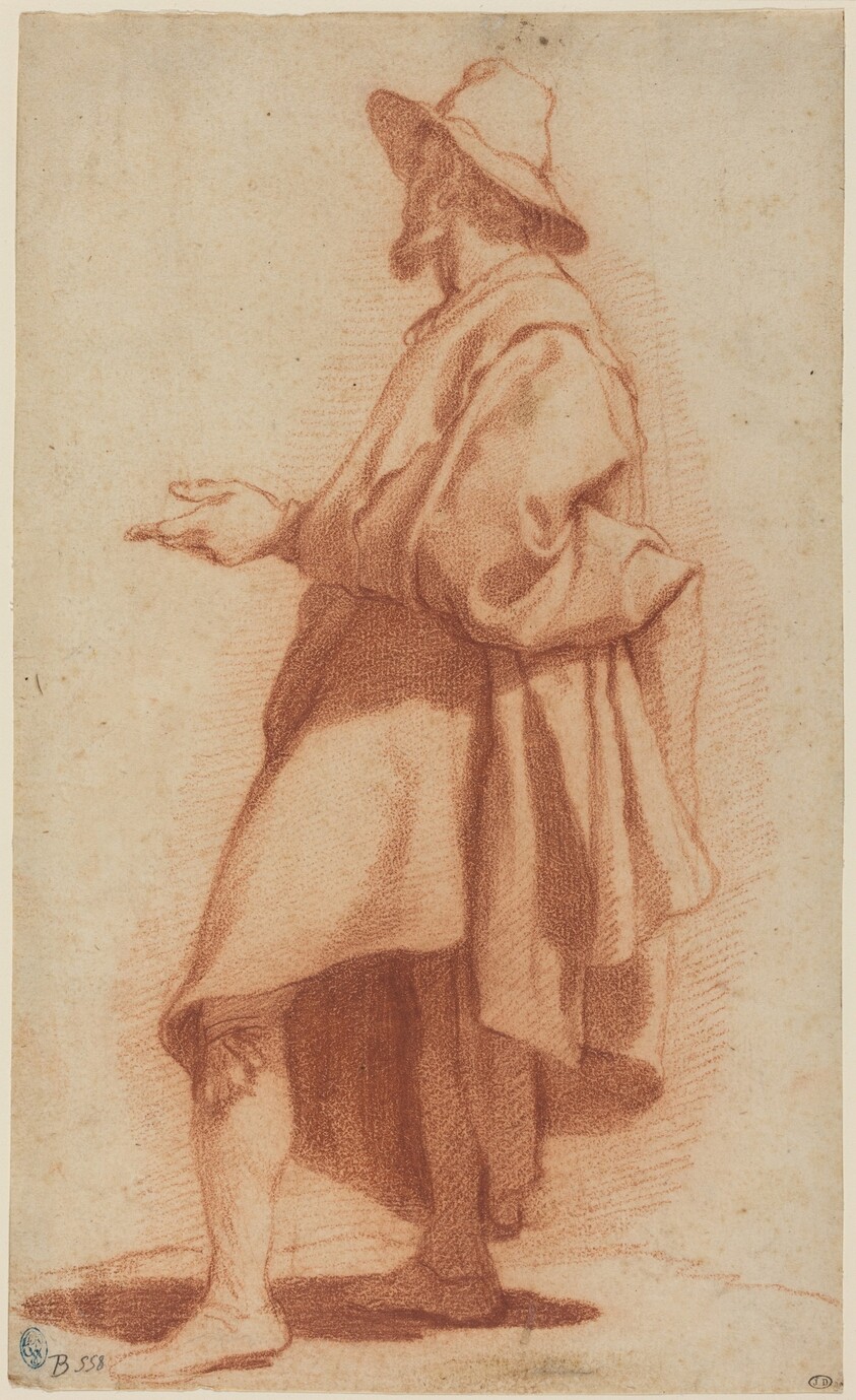 Standing Man Wearing a Cloak and Hat