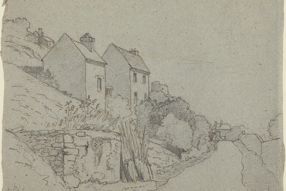 House on a hillside with a road running beneath.