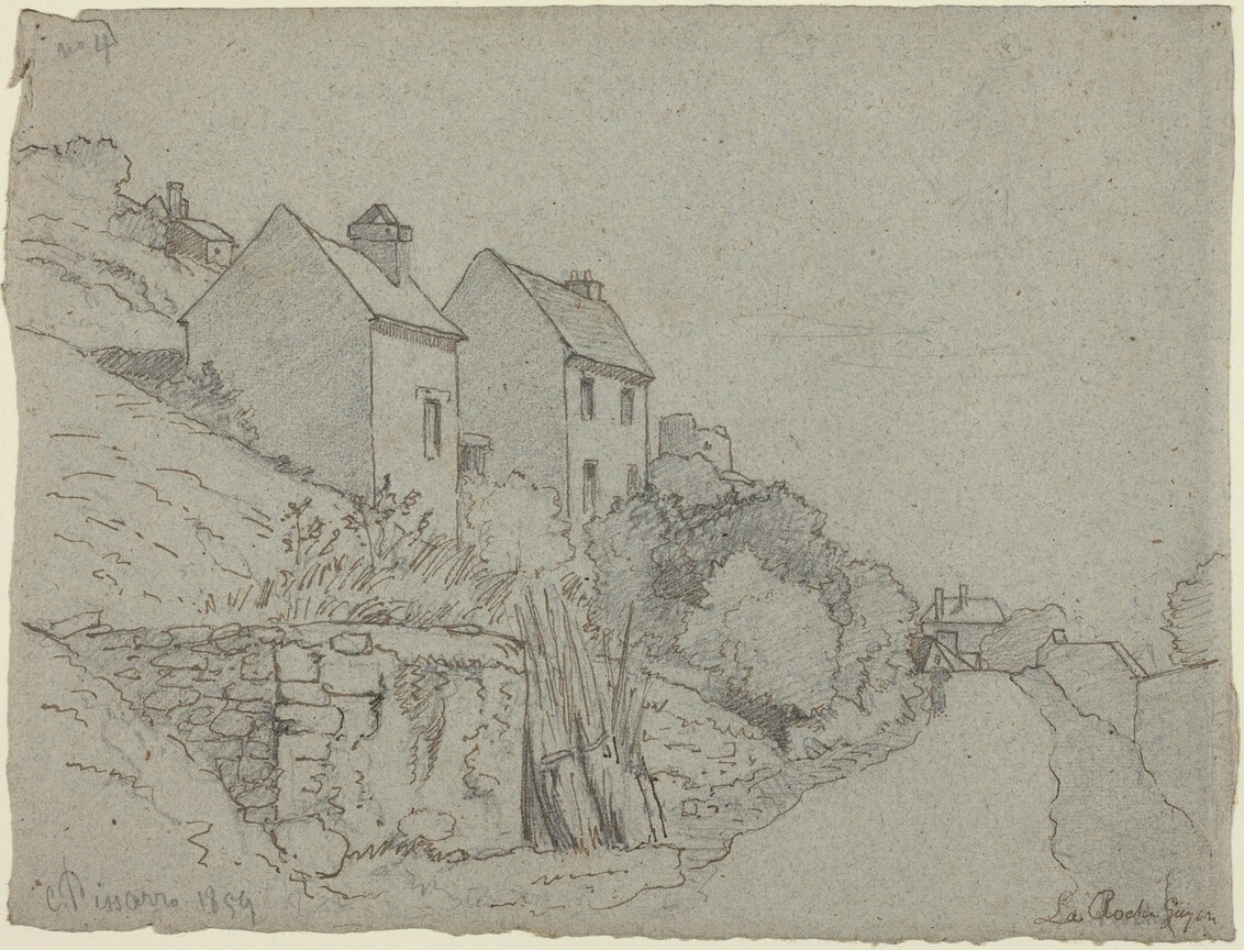 House on a hillside with a road running beneath.