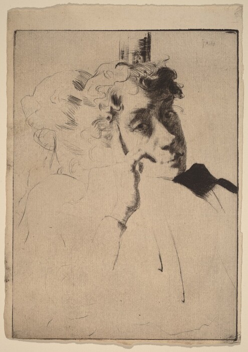 The image shows a person from the shoulders up. They are in a relaxed position, with their head resting on their hand. Their facial features are soft and expressive, with gently closed lips and slightly downcast eyes. The person has curly and voluminous hair framing their face. The clothing is simple, and there are no visible accessories or objects. The background is plain.