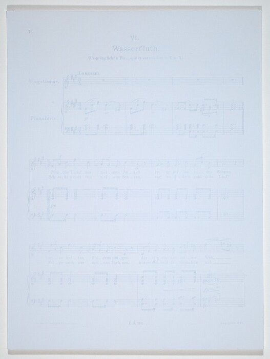 This is a photograph of a sheet of music. The image features a musical score titled "Wasserfluth." The title and musical notation are printed in a traditional layout suitable for voice and piano, with sections marked for "Singstimme" and "Pianoforte." The sheet music includes detailed music and lyrics, represented by musical notes on staves and German text beneath the notes. There are various musical directions and dynamics indicated throughout the sheet, such as "Langsam." The presentation is formal, and this composition is originally in F-sharp minor, later transposed to E minor as noted under the title. The sheet is neatly printed and shows typical wear of a vintage music manuscript with faint printing on a light background.