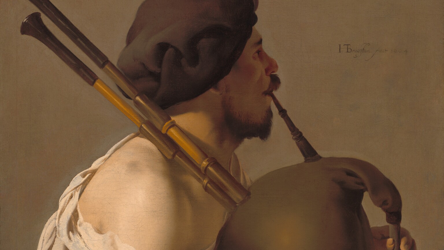 Shown from the lap up, a man with pale skin sits facing our right in profile, playing a bagpipe in this vertical painting. He is lit from our left so his face is in shadow, and he looks off to our right. He has dark eyebrows, a chestnut-brown mustache and short beard, and a rounded nose. He wears a floppy, chocolate-brown beret that covers his hair and the ear facing us. A cream-white, voluminous shirt falls off the shoulder close to us, and a fawn-brown robe gathers around his lap. He blows into a long mouthpiece as he squeezes the tawny-brown bag of the instrument between his forearms. Two long, wooden pipes rest over his shoulder, and he covers the finger-holes of the flute-like chanter at the front of the bag. The background behind him is pale peanut brown. The artist signed and dated the painting just to the right of the musician’s face, “HTBrugghen fecit 1624,” with the HTB intertwined into a monogram.