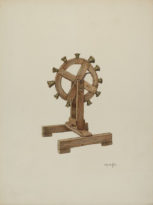 The image displays a wooden wheel with a metal framework and small bell-like objects attached to its perimeter, mounted on a wooden stand. The color palette consists of mostly brown, beige, and metallic gray tones. The object is centered against a light-colored background, with a signature located below and slightly to the right of the wheel's base.